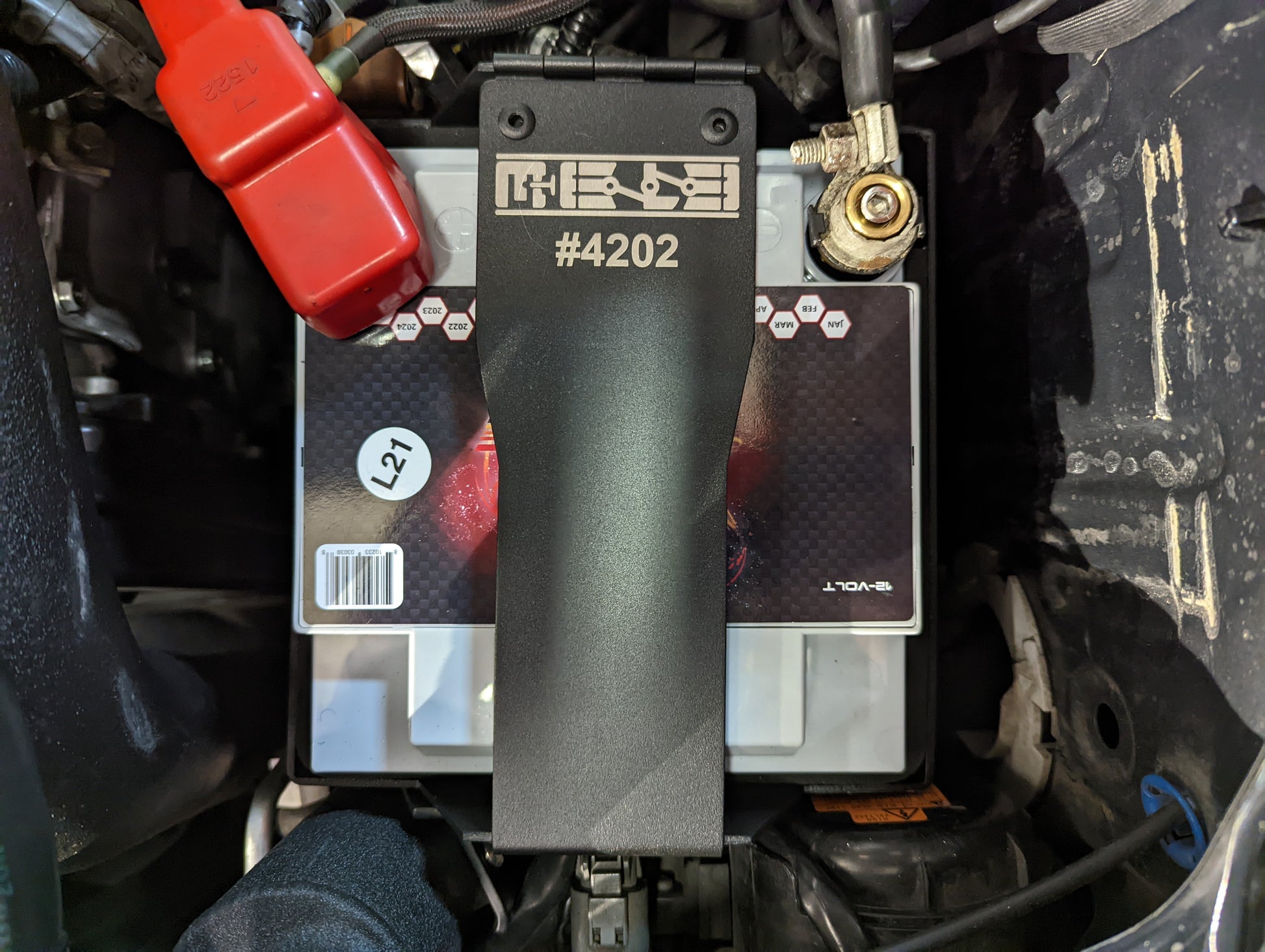 Installed image of MeLe aluminum battery mount for 2002 - 2007 Subaru WRX and STI